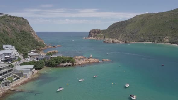 Aerial: Swimmers enjoy lagoon, Knysna Heads and Indian Ocean beyond