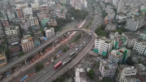 Flyover U Loop, Dhaka, Bangladesh. Aerial Drone orbits U Loop highway road