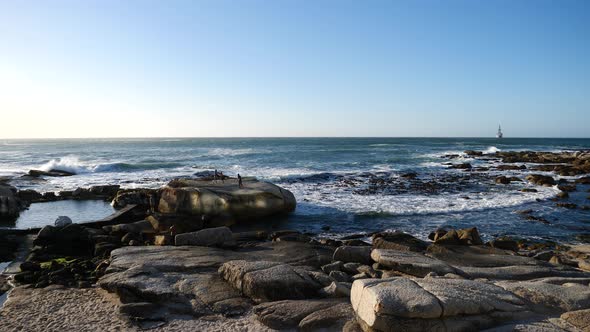 Bantry Bay, South Africa in late afternoon sunlight on a blue sky day at the Atlantic Ocean. Viewpoi