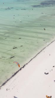 Vertical Video Kitesurfing Near the Shore of Zanzibar Tanzania