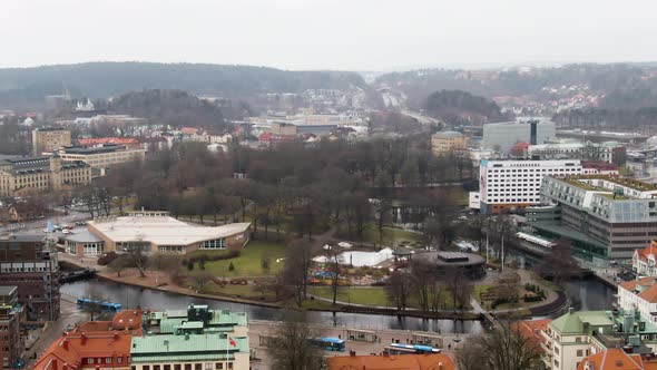 Public bus stop on downtown of majestic town Borås with colorful buildings, aerial drone view