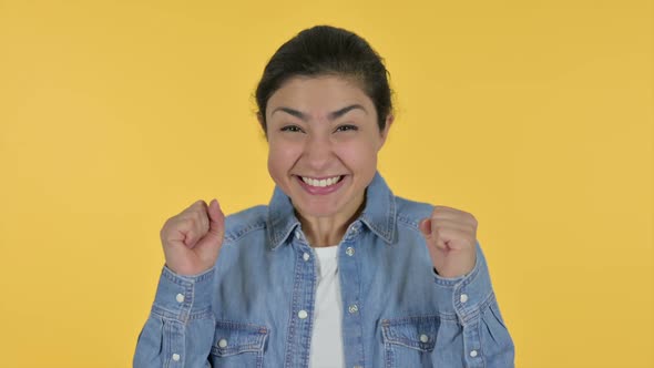 Excited Indian Woman Celebrating Yellow Background