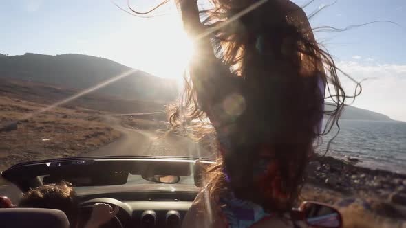 Sporty Girl Standing in Cabriolet