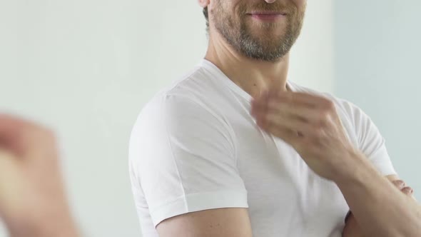 Good-Looking Man Touching His Beard, Admiring Himself in Front of Mirror