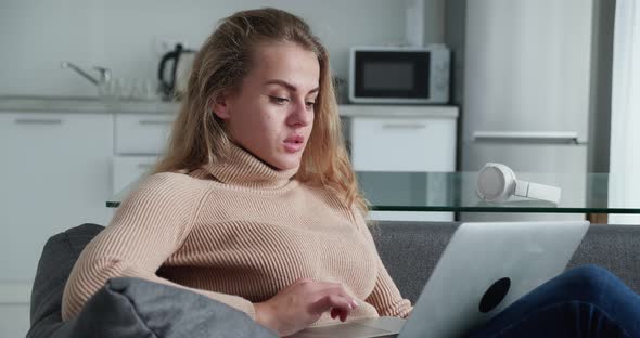 Focused Woman Works on Freelance From Modern Home