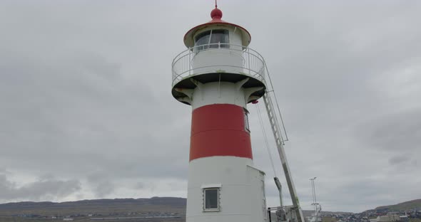Wide Tilt Down of Skansin Lighthouse in Torshavn, Faroe Islands