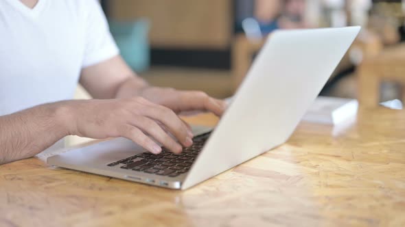 Close Up of Hands Working on Laptop