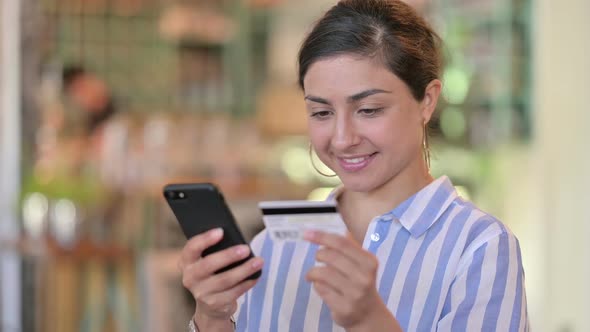 Attractive Young Latin Woman Using Smartphone