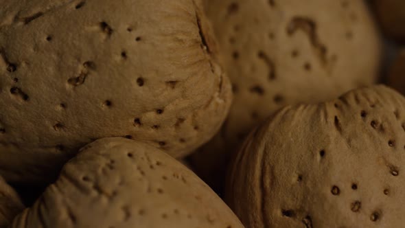 Cinematic, rotating shot of almonds on a white surface - ALMONDS