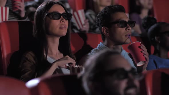 Mixed Race Couple Enjoying 3d Movie in Cinema
