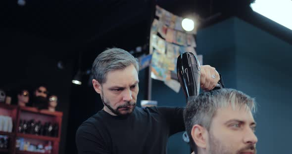 Brutal Stylist Dries Hair to a Grayhaired Man