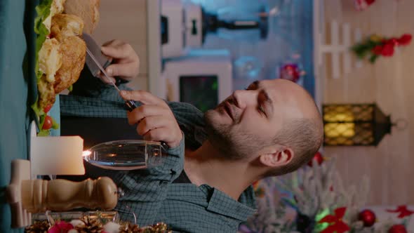 Vertical Video Cheerful Couple Celebrating Christmas Eve with Festive Dinner