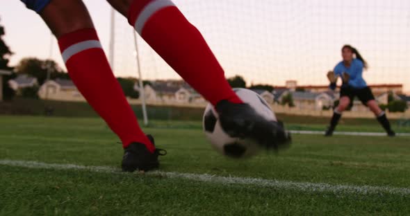 Female keeper waiting for female soccer player to kick the ball. 4k