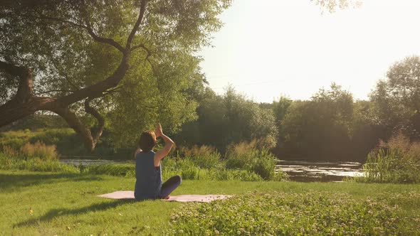 Practicing yoga in park