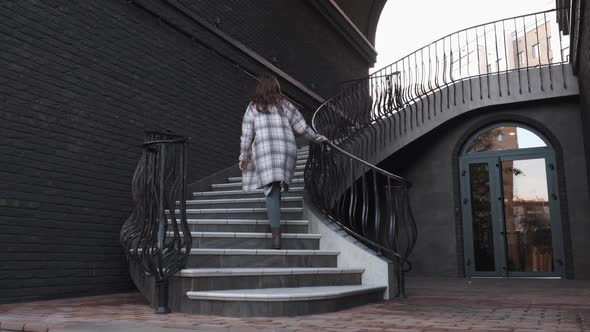 Attractive Girl Climbs the Stairs, Autumn Day