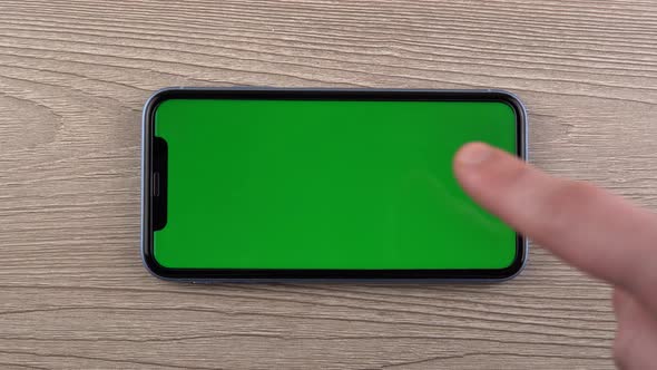 Smartphone with Green Screen Mockup Swipe Scroll Gesture Hand Close Up Mobile