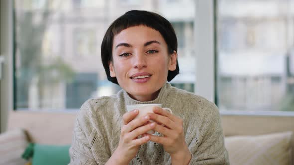 In the Coffee Shop in Front of the Camera Looking