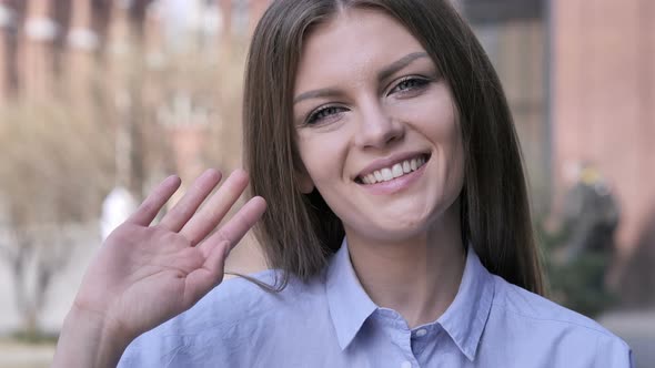 Hello, Young Woman Waving Hand to Welcome