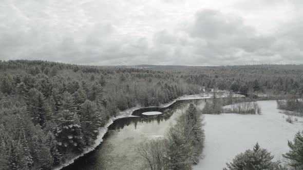 Winter cloudy afternoon at Piscataquis river. Maine. USA. Aerial view