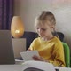 Child Learns Online Using Laptop - VideoHive Item for Sale