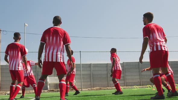 Soccer players training on field