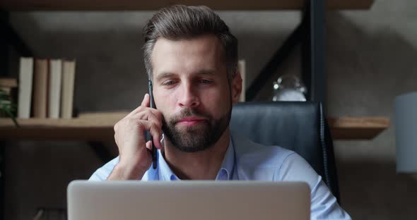 Business Man Talking Mobile Phone at Office Workplace