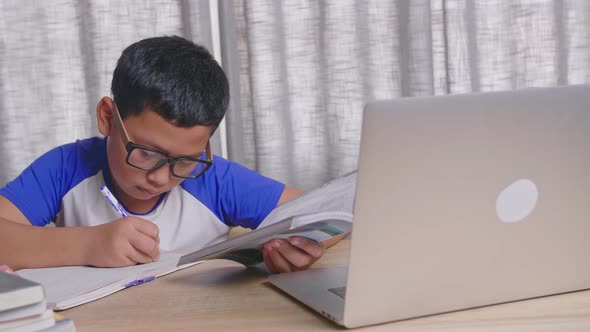 Asian Boy Learning At Home