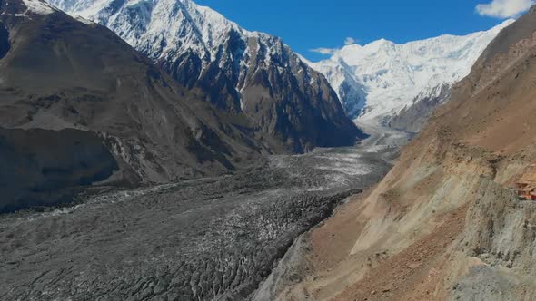 Aerial Over Hopar Glacier In Nagar Valley With Snow Capped Mountains. Dolly Forward