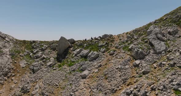 passing over head tourists in mountain with opening view on valley in mountains