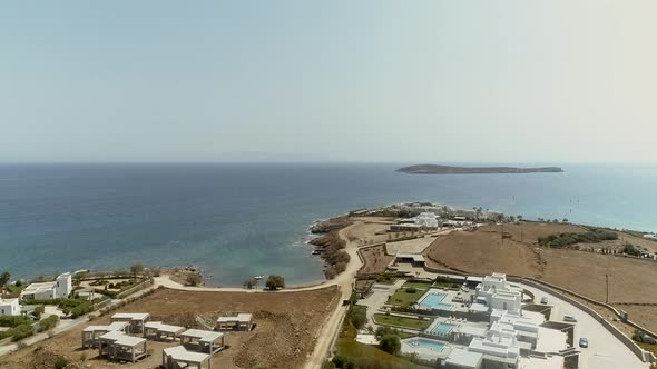 Aerial view of shore at Naousa city, with traditional white houses, Greece.