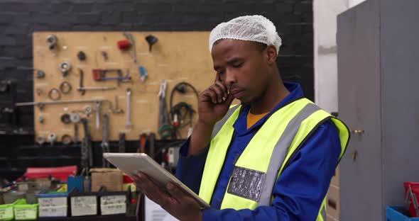 Warehouse worker using a digital tablet