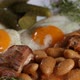 Spreading herbs over baked beans, eggs and pork meat - VideoHive Item for Sale