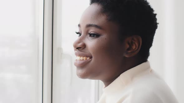 Portrait of Afro American Girl Ethnic Black Woman Female Profile Looking Out Window Standing in