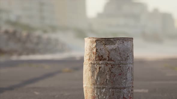 Old Rusty Metal Barrel on the Street