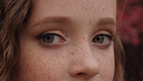 Closeup Portrait of a Little Girl's Face with Red Hair and Freckles