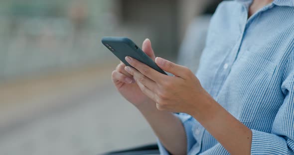 Woman use of mobile phone at outdoor