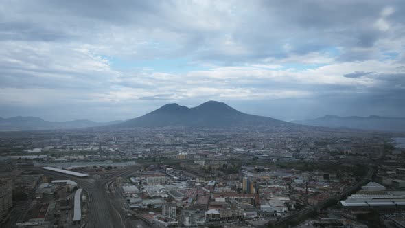 Fast aerial zoom hyperlapse of clouds flying past Mount Vesuvius in Naples, Italy.