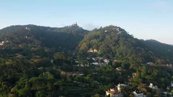 Dense Settlement with Lighthouse Building on the Top of Hillside