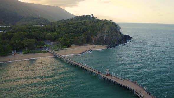 Aerial, Beautiful Seascape And A  Pier And Beach With Tropical Vegetation In Palm Cove