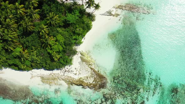 Aerial above nature of paradise island beach holiday by clear sea with white sandy background of a d