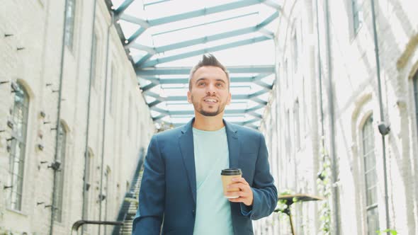 Young successful caucasian businessman works outdoor