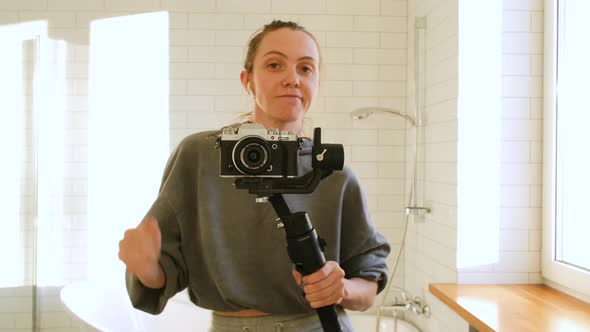Woman Blogger Dancing with Camera on Stabilizer