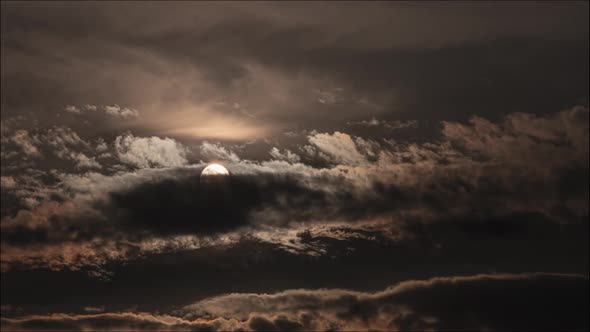 Time lapse: amazing clouds moving the sky illuminated by the sun