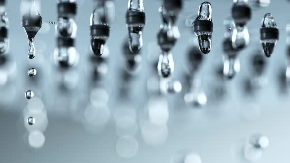 Super Slow Motion Detail Shot of Water Droplets Falling From Shower Head at 1000Fps