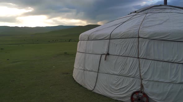 A White Ger in The Meadows of Mongolia at Sunrise