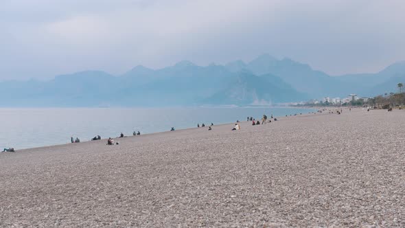 People Relax on the Beach By the Sea