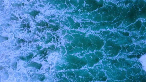 Aerial view top view video beautiful closeup shot beach and seawater on wave