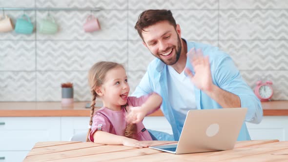 Young family with a child talking using a microphone and webcam