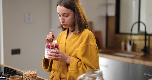 Woman Eating Healthy Cereal Breakfast