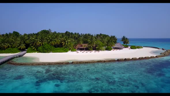 Aerial sky of beautiful island beach wildlife by blue water with white sandy background of a dayout 